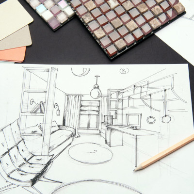 On the table are a drawing of pencil-drawn design room design. I